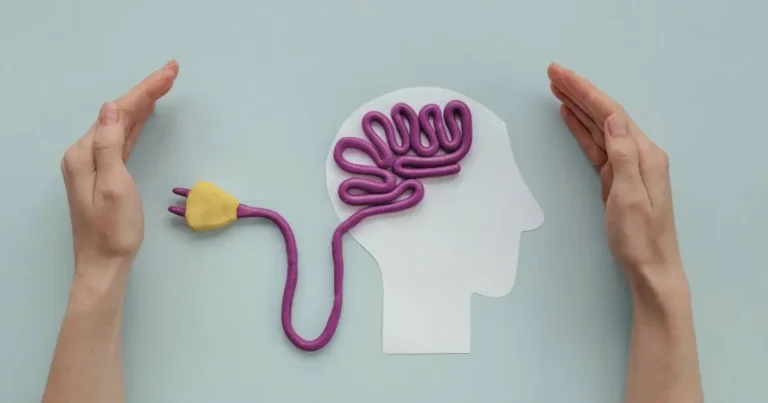 Hands protecting a creative brain made from wire, symbolizing the mental and emotional resilience needed for CFA exam preparation