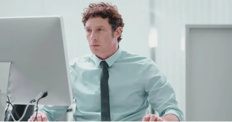 Focused Professional CFA Candidate Preparing for Exam