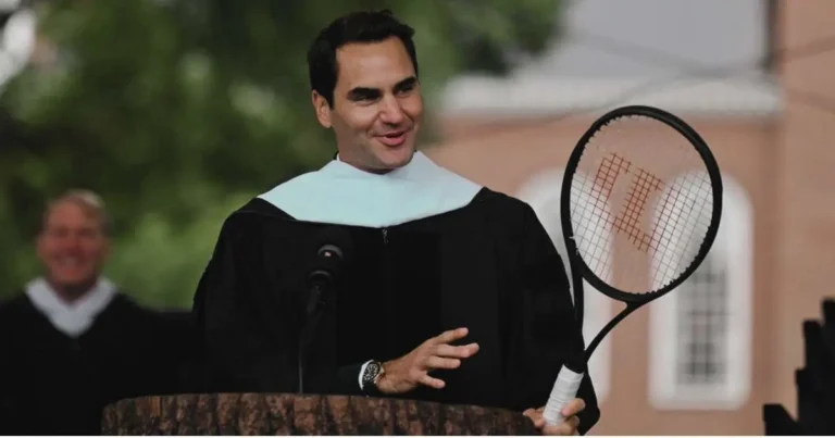 Roger Federer giving a commencement address holding a tennis racket