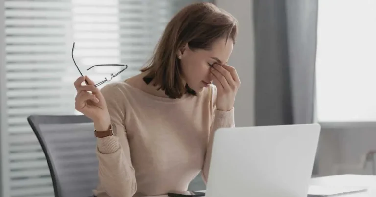 Woman experiencing study fatigue while preparing for CFA exams