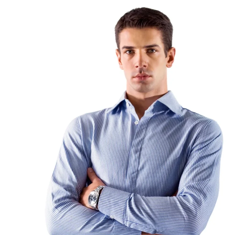 Professional man in a smart shirt with folded arms and focused expression