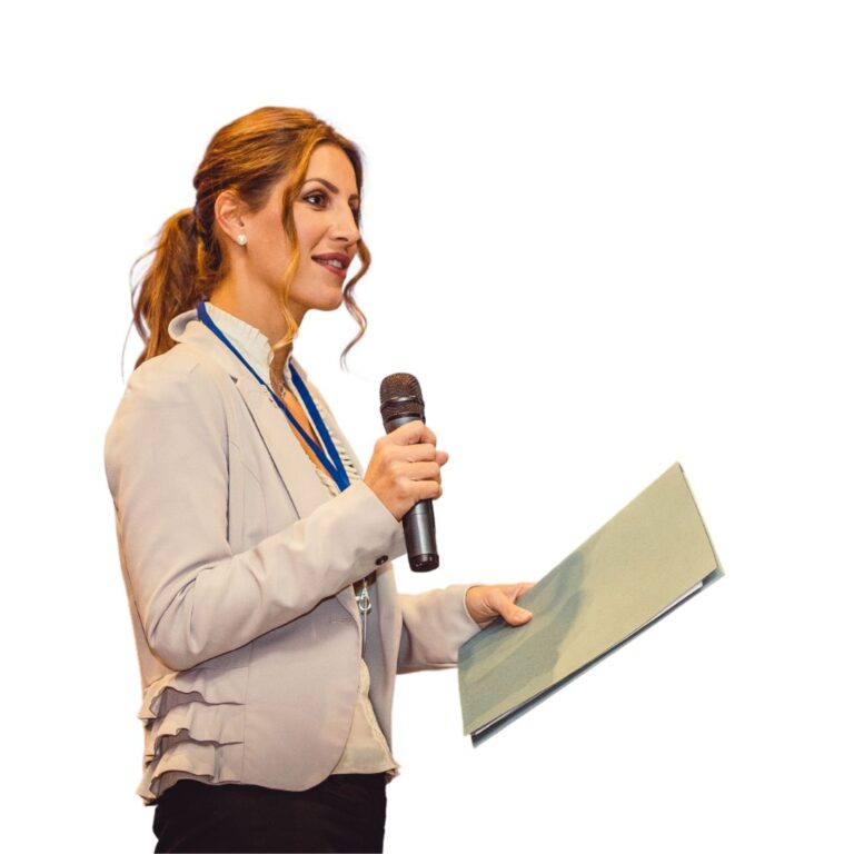 Female CFA Society leader speaking at a professional conference.