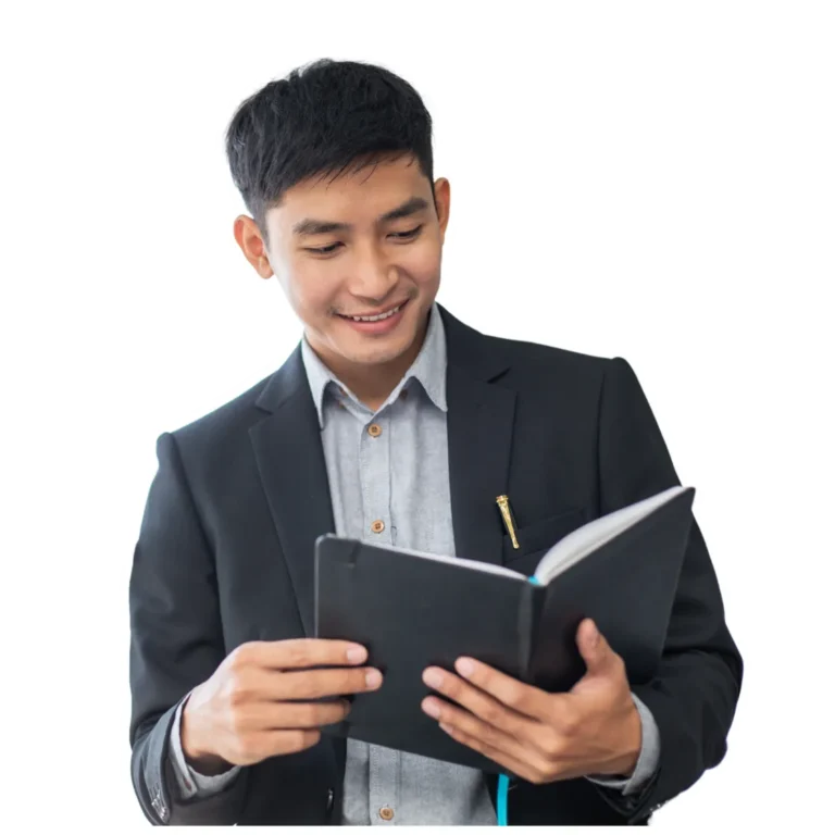CFA candidate reading a professional book with curiosity