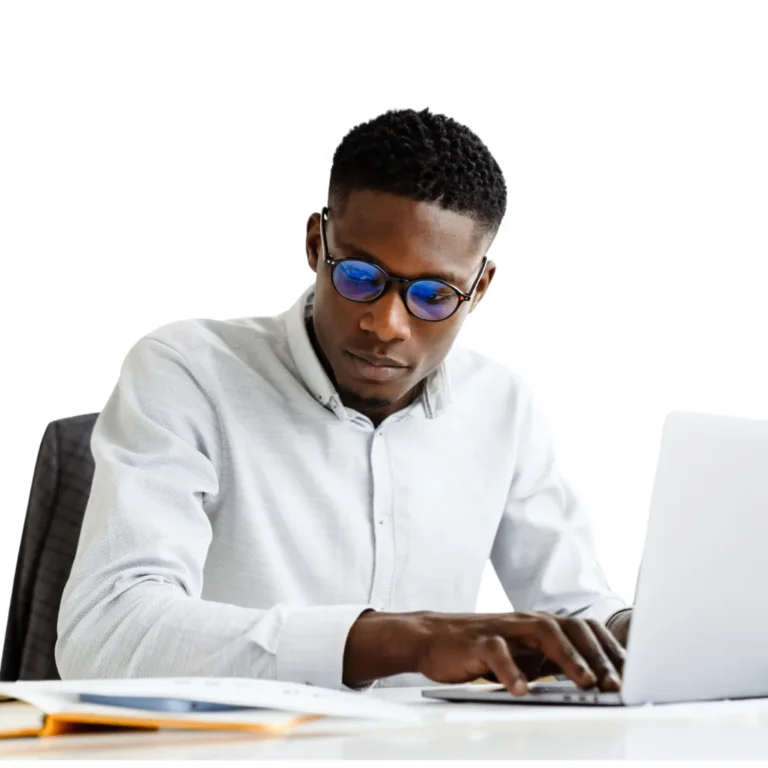 CFA candidate in glasses studying curriculum content on a laptop