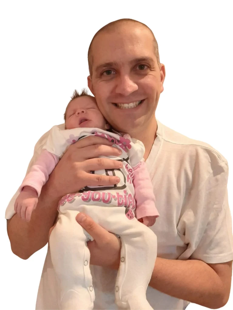Man holding newborn baby during CFA study journey