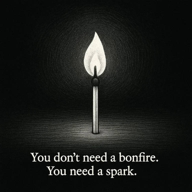 Lit match in darkness with caption “You don’t need a bonfire. You need a spark.”
